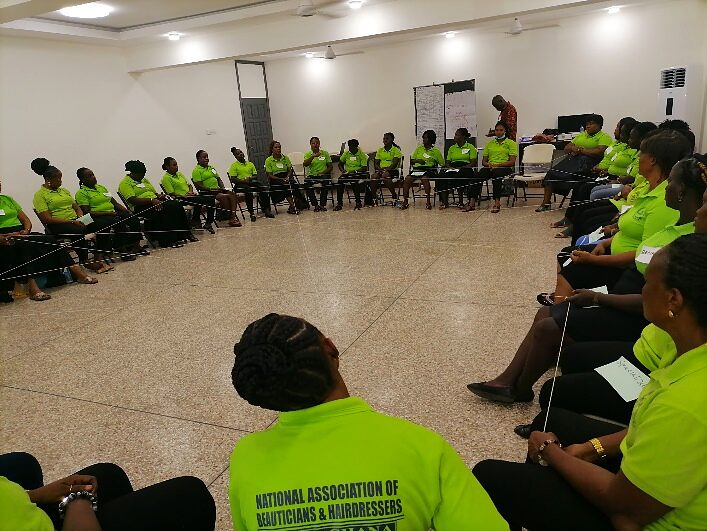 Rows of association members seated at a plenary conference session
