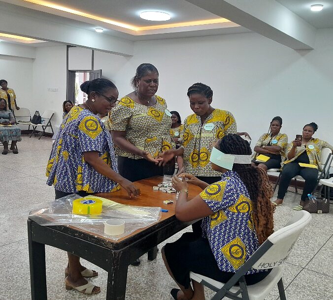 Facilitated dialogue between participants seated around working tables