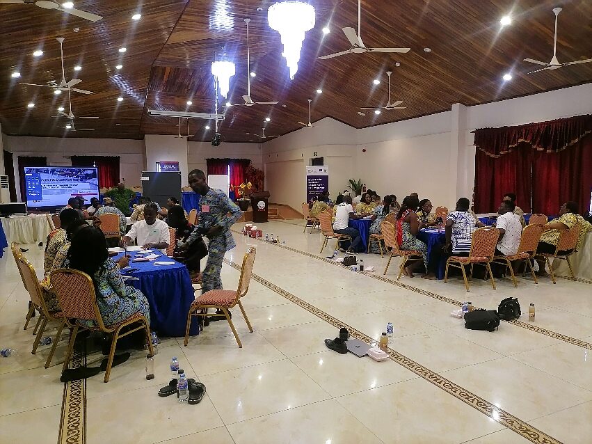 Institutional partners working across tables in a stakeholder engagement session